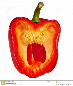 Red ripe pepper cut in half.